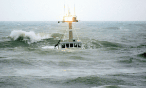 Fishing boat navigating rough sea waves