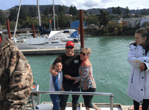Family and friends enjoying a day at marina.